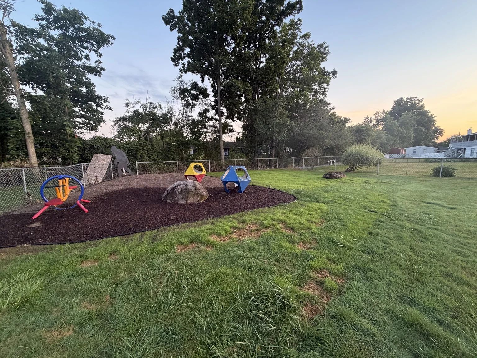 Backyard after playground mulch installation